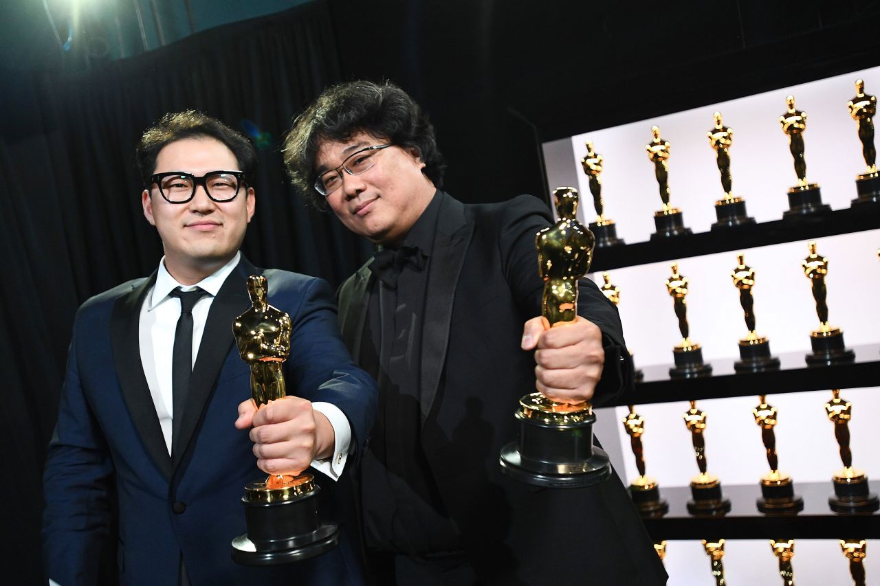 Han Jin Won, left, and Bong Joon Ho pose backstage with the Oscar for best international feature film ("Parasite"). It is South Korea's first victory in this category, which used to be called best foreign-language film.