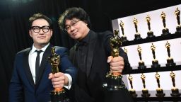 In this handout photo provided by A.M.P.A.S. Best Original Screenplay award winners Han Jin Won and Bong Joon Ho pose backstage during the 92nd Annual Academy Awards at the Dolby Theatre on February 09, 2020 in Hollywood, California.
