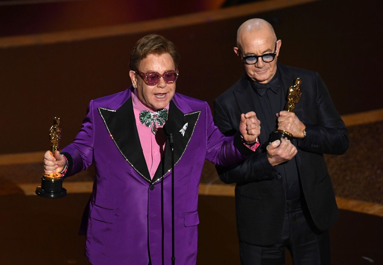 Elton John, left, and Bernie Taupin accept the Oscar for best original song, which was "(I'm Gonna) Love Me Again" from the movie "Rocketman." Taupin, John's longtime collaborator, <a href="https://www.cnn.com/entertainment/live-news/oscars-2020/h_4c673b933b52eb05108e5e1c57659be5" target="_blank">credited the win</a> to "53 years of hammering it out and doing what we do."