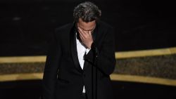 Joaquin Phoenix reacts as he accepts the award for best performance by an actor in a leading role for "Joker" at the Oscars on Sunday, Feb. 9, 2020, at the Dolby Theatre in Los Angeles. (AP Photo/Chris Pizzello)