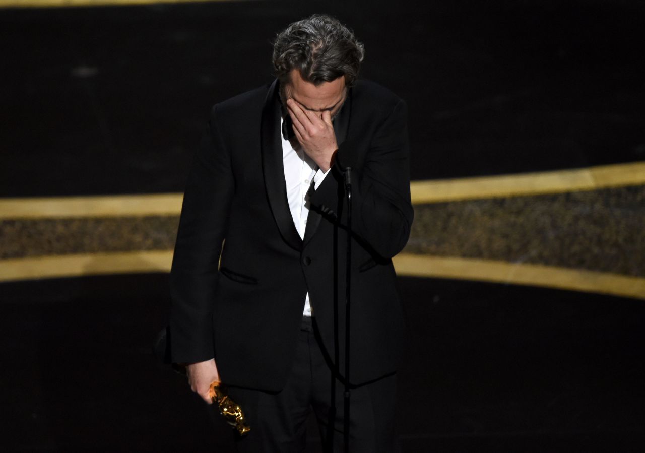 Joaquin Phoenix reacts as he accepts the best actor Oscar ("Joker"). He remembered his late brother, actor River Phoenix, in his speech, <a href="https://www.cnn.com/entertainment/live-news/oscars-2020/h_a1b97753f5251e167cb2ccbc3fe8b94b" target="_blank">quoting a lyric</a> that River wrote in an old song. Phoenix is now <a href="https://www.cnn.com/entertainment/live-news/oscars-2020/h_578ebe1c1d522b367866dea6813f063f" target="_blank">the second person to win an Oscar for playing the Joker.</a> The first person to win for playing the character was the late Heath Ledger.