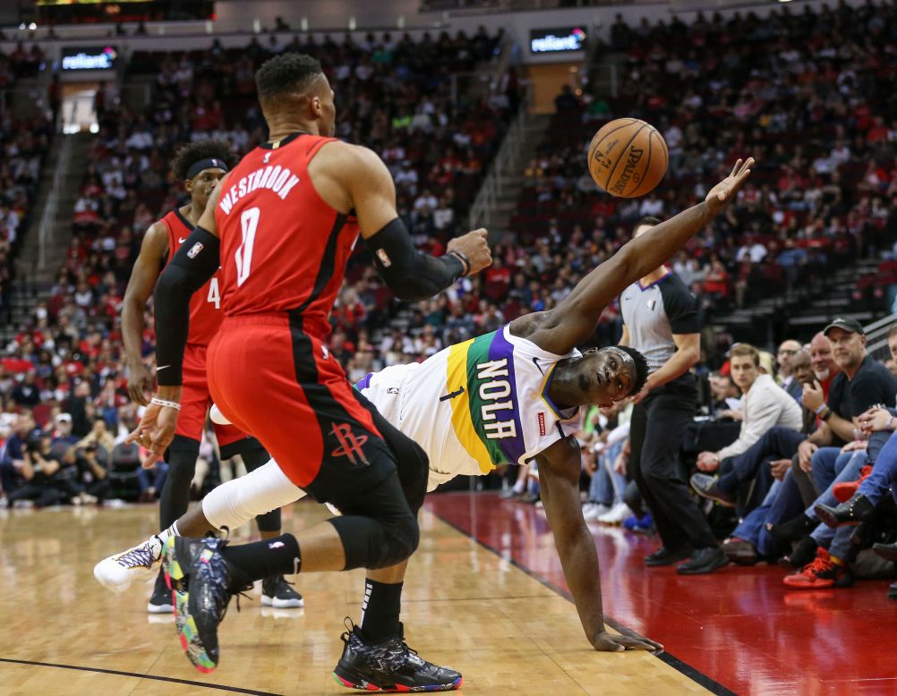 Zion Williamson stretches for a loose ball during an NBA game in Houston on Sunday, February 2.