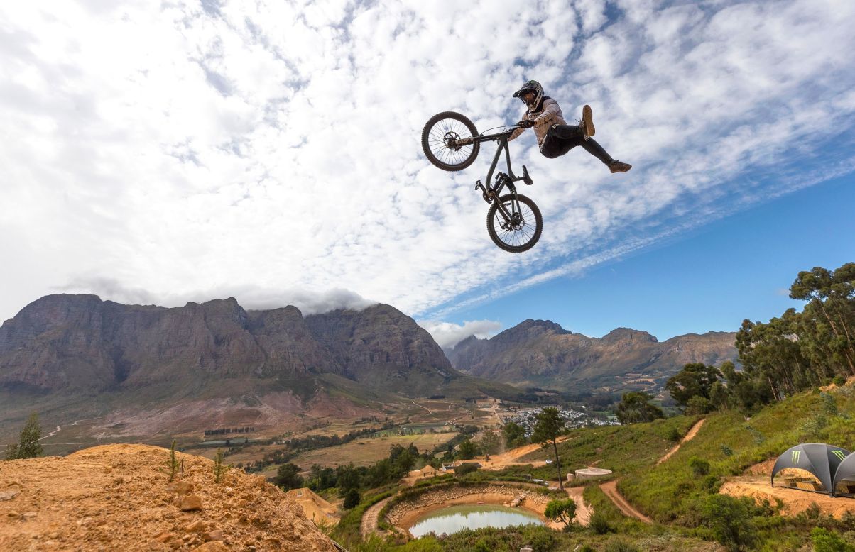 Tom van Steenbergen catches air Thursday, February 6, while practicing for a freeride mountain-biking event in Stellenbosch, South Africa.
