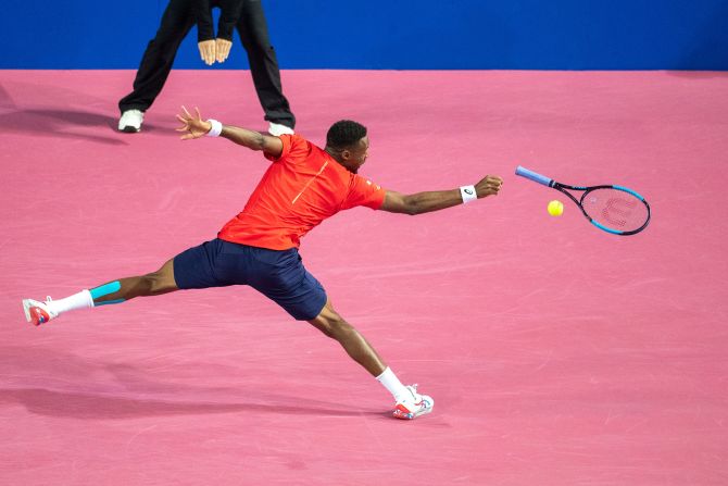 Gael Monfils loses the grip of his racket as he plays a shot in Montpellier, France, on Saturday, February 8.