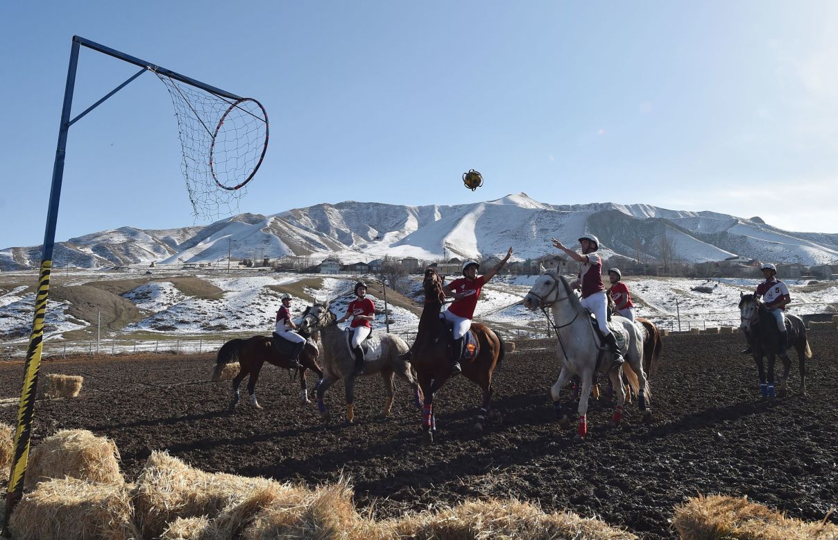 Players from Canada and France compete in a horse-ball match in Kok-Jar, Kyrgyzstan, on Sunday, February 9.
