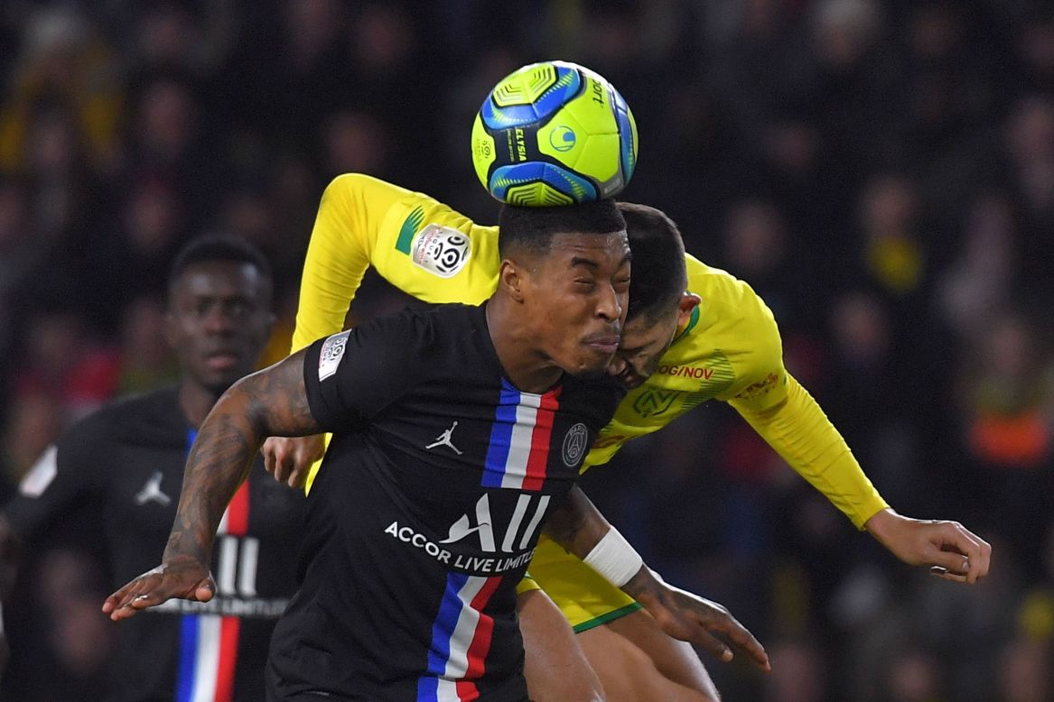 PSG's Presnel Kimpembe, left, heads the ball during a French league match against Nantes on Tuesday, February 4.