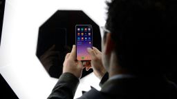 A visitor tests the new Xiaomi Mi 9 smartphone at the Mobile World Congress (MWC) in Barcelona on February 27, 2019. - Phone makers will focus on foldable screens and the introduction of blazing fast 5G wireless networks at the world's biggest mobile fair as they try to reverse a decline in sales of smartphones. (Photo credit should read JOSEP LAGO/AFP via Getty Images)