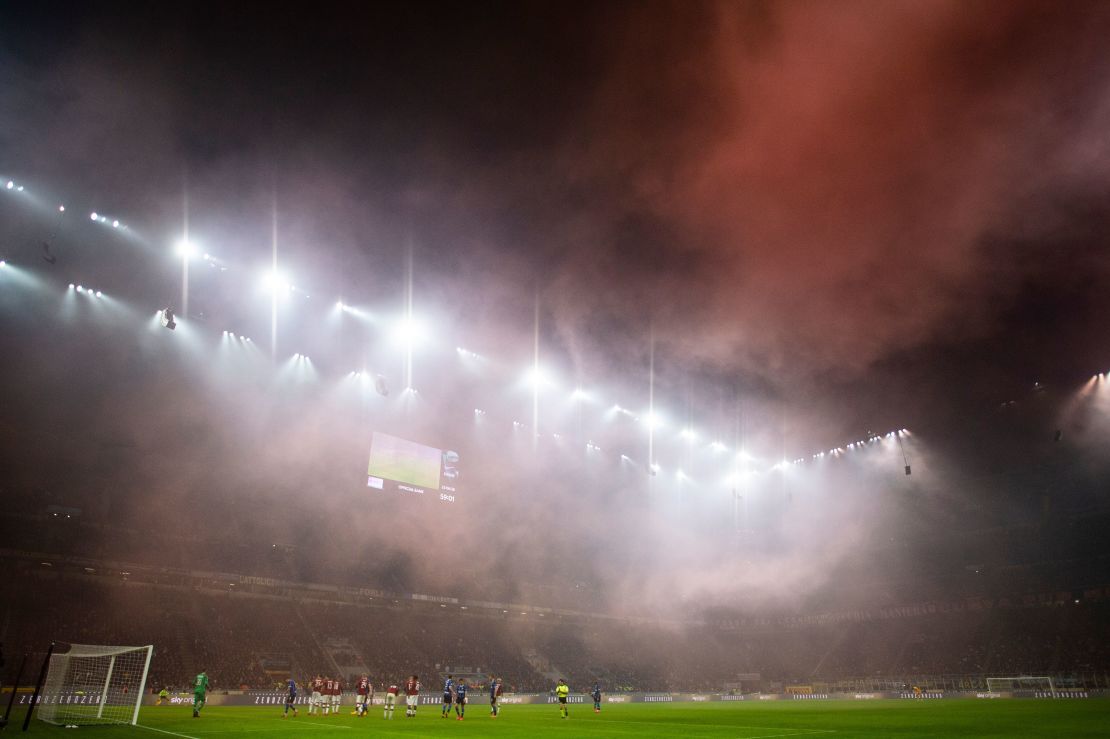 AC Milan's supporters light smoke bombs during the dramatic derby. 