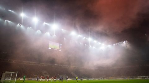 AC Milan's supporters light smoke bombs during the dramatic derby. 