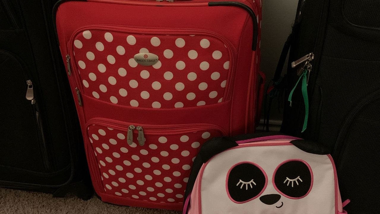 The Singletons had their bags packed to fly to China to bring home their adoptive daughter, Lottie.