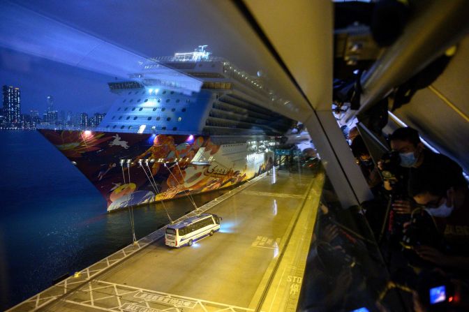 Photojournalists wearing face masks take photos of a bus carrying passengers after they disembarked from the World Dream cruise ship in Hong Kong on February 9. <a href="index.php?page=&url=https%3A%2F%2Fwww.cnn.com%2F2020%2F02%2F05%2Fasia%2Fcoronavirus-cruise-quarantines-intl-hnk%2Findex.html" target="_blank">More than 5,300 people were quarantined on two cruise ships</a> off Hong Kong and Japan.