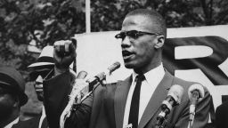 circa 1963:  American civil rights leader Malcolm X (1925 - 1965)  at an outdoor rally, probably in New York City.  (Photo by Bob Parent/Hulton Archive/Getty Images)