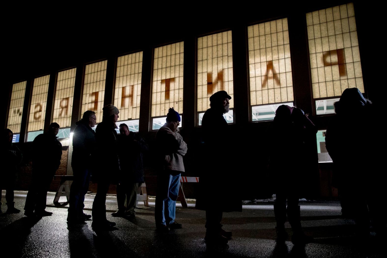 Voters in Manchester wait outside for a precinct to open at Parker-Varney Elementary School on February 11.