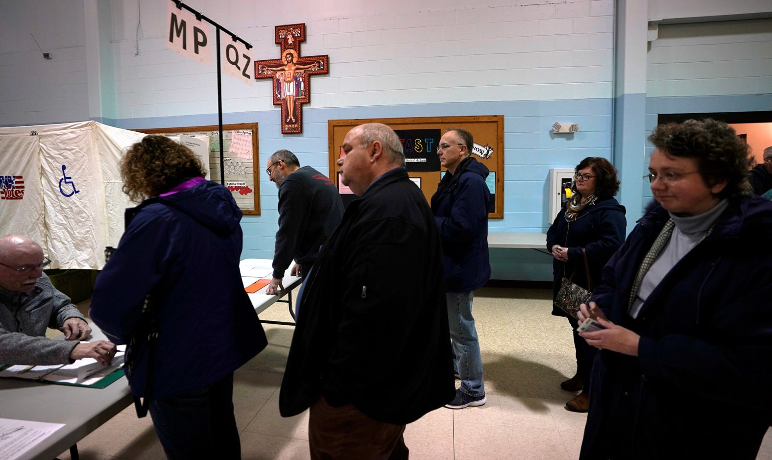 Voters wait in line at St. John Neumann Church in Merrimack, New Hampshire.