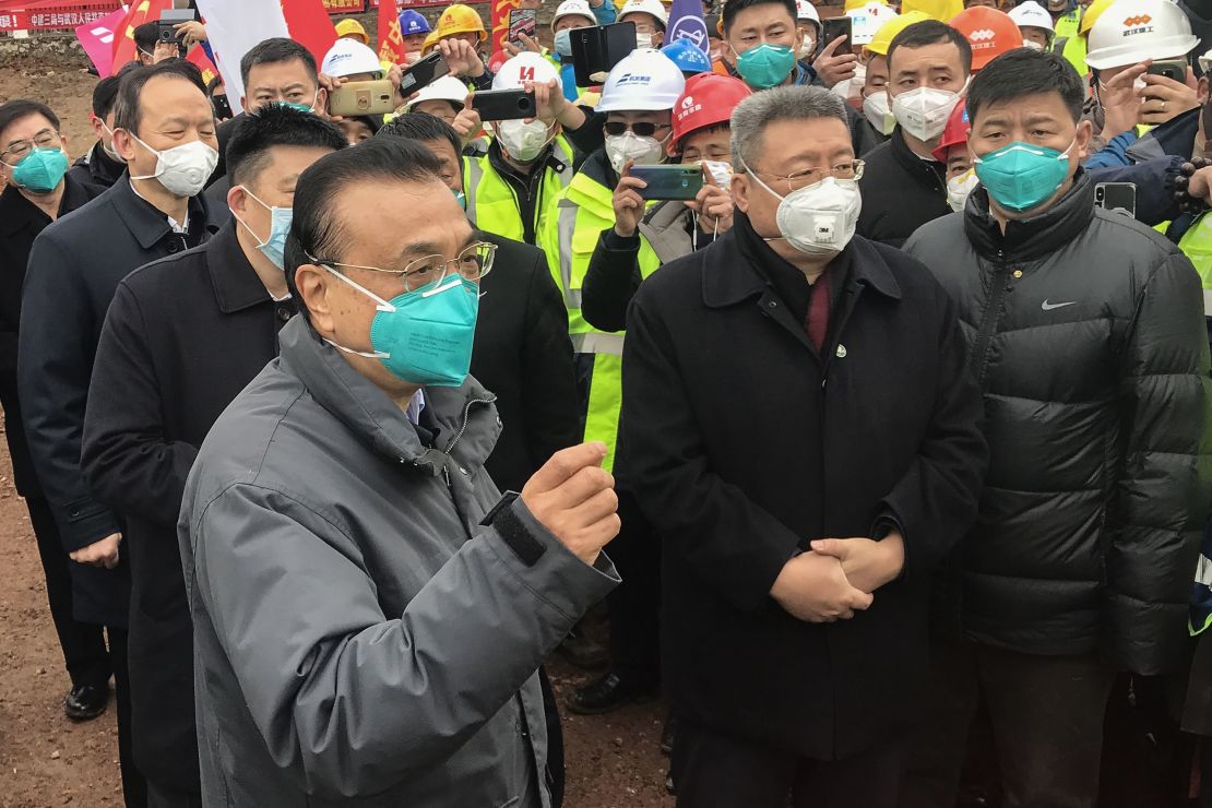 Chinese Premier Li Keqiang speaks as he visits a construction site of a new hospital being built to treat patients of a deadly virus outbreak in Wuhan in China's central Hubei province on January 27.