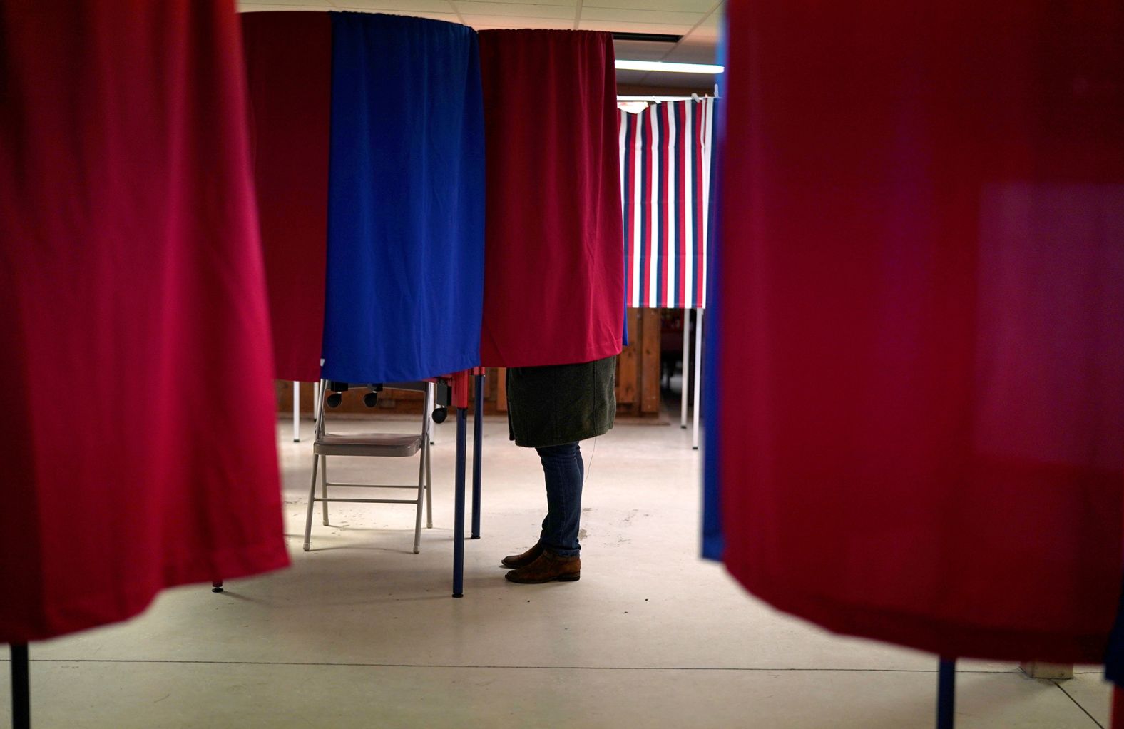 A voter marks her ballot in Milton, New Hampshire.