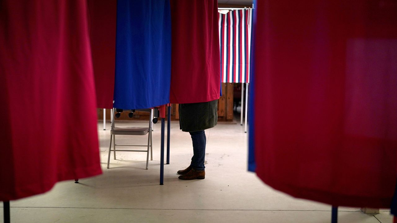 A voter marks her ballot in the state's presidential primary election in Milton, New Hampshire, U.S., February 11, 2020. REUTERS/Rick Wilking