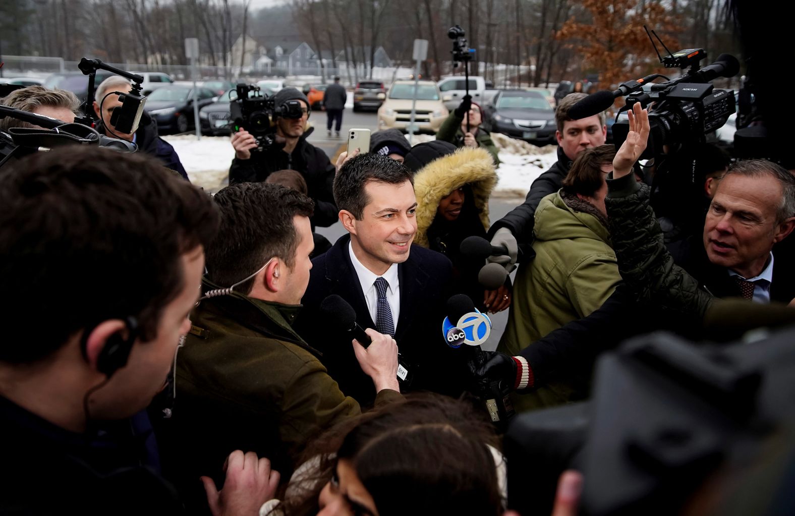 Buttigieg speaks to the media outside a polling center in Nashua on February 11.