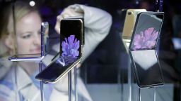 Samsung Galaxy Z Flip Phones are displayed at the Unpacked 2020 event in San Francisco, Tuesday, Feb. 11, 2020. (AP Photo/Jeff Chiu)