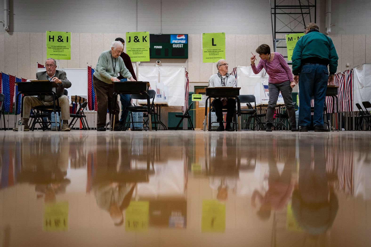 Poll workers check in voters in Hooksett, New Hampshire.