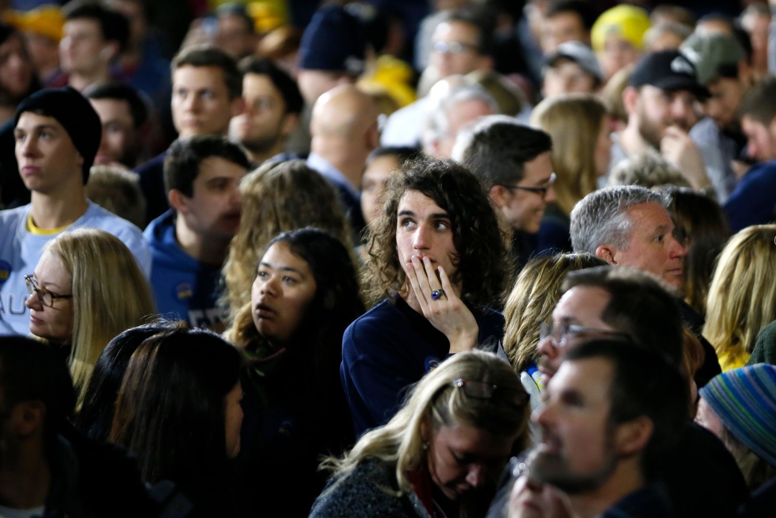 Buttigieg supporters watch results come in at his rally in Nashua.