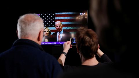 Biden accompanied by his wife Jill speaks to supporters on televised message from South Carolina at his New Hampshire primary night rally in Nashua, New Hampshire 