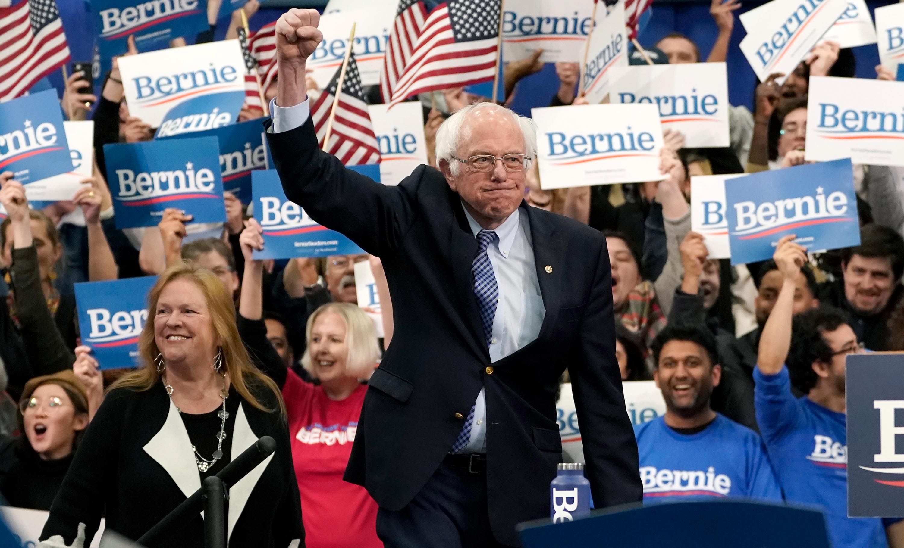 US Sen. Bernie Sanders takes the stage during his primary-night event in Manchester, New Hampshire, on Tuesday, February 11. "This victory here is the beginning of the end for Donald Trump," Sanders said in his speech.