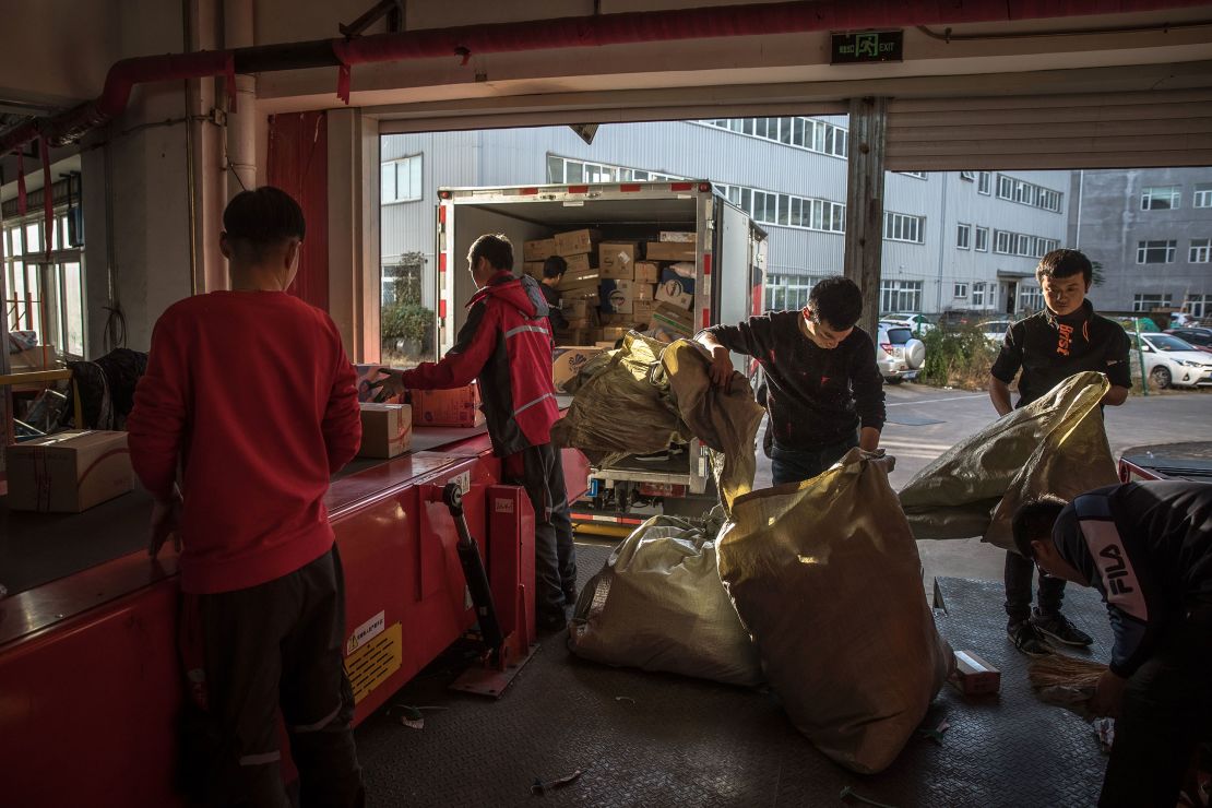 Workers sorting packages at a delivery station for JD.com in Beijing in November.