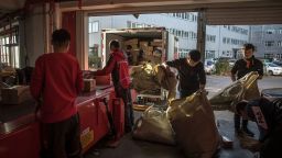 Workers sort packages at a delivery station for Chinese e-commerce giant JD.com on Singles' Day, in Beijing, China, 11 November 2019.