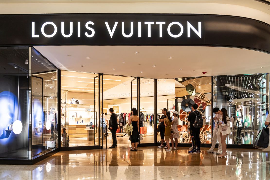 Customers lining up in front the Louis Vuitton store in Shanghai, China.