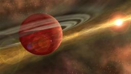 Artist's conception of a massive planet orbiting a cool, young star. In the case of the system discovered by RIT astronomers, the planet is 10 times more massive than Jupiter, and the orbit of the planet around its host star is nearly 600 times that of Earth around the sun.