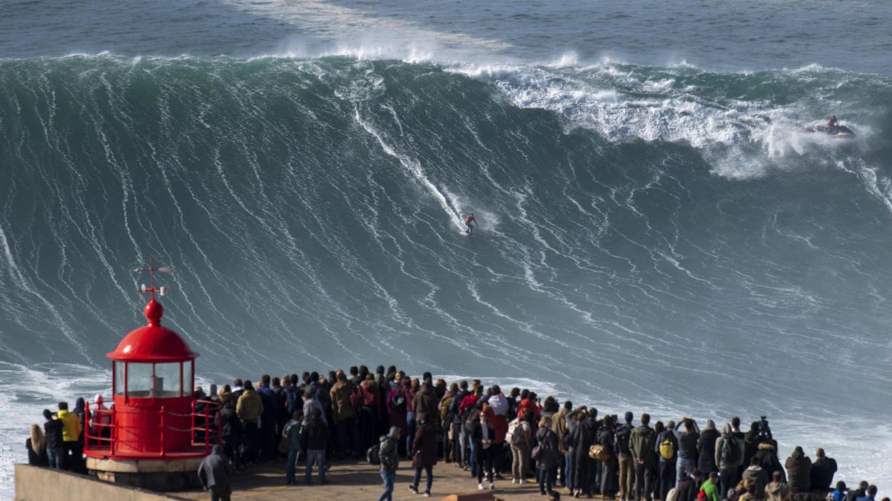 Brazilian surfer Rodrigo Koxa rides a wave during a free surfing session in Nazare, on November 20, 2019, waves reached between 15 and 20mt high. - Nazare host one the two big waves surfing contest in the world, with waves reaching up to 30 meters at winter time. (Photo by Olivier MORIN / AFP) (Photo by OLIVIER MORIN/AFP via Getty Images)