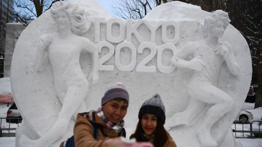 <strong>Tokyo 2020: </strong>A couple poses for a selfie in front of a snow sculpture with a motif of the upcoming Tokyo 2020 Olympic Games. The Sapporo Snow Festival, which opened January 31, is a major draw for the region, attracting more than 2.7 million visitors last year. 