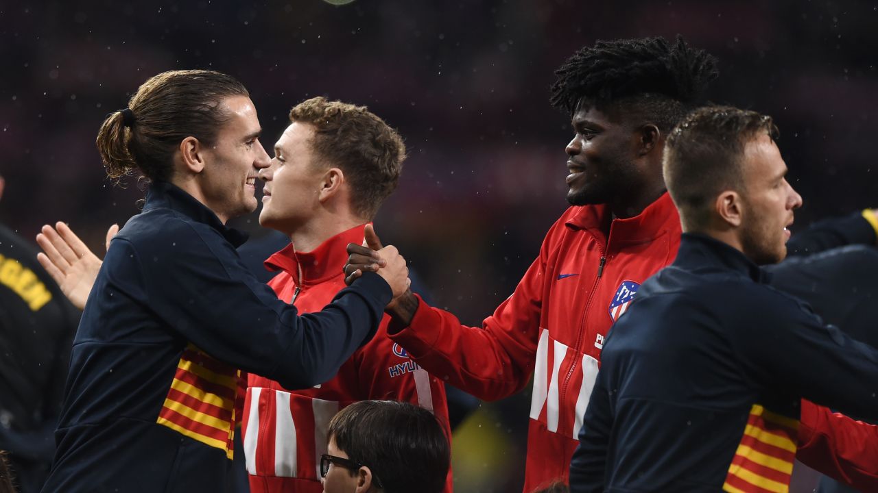 Antoine Griezmann of FC Barcelona shakes hands with former teammate Partey prior to the La Liga match against Atletico at Wanda Metropolitano on December 01, 2019.