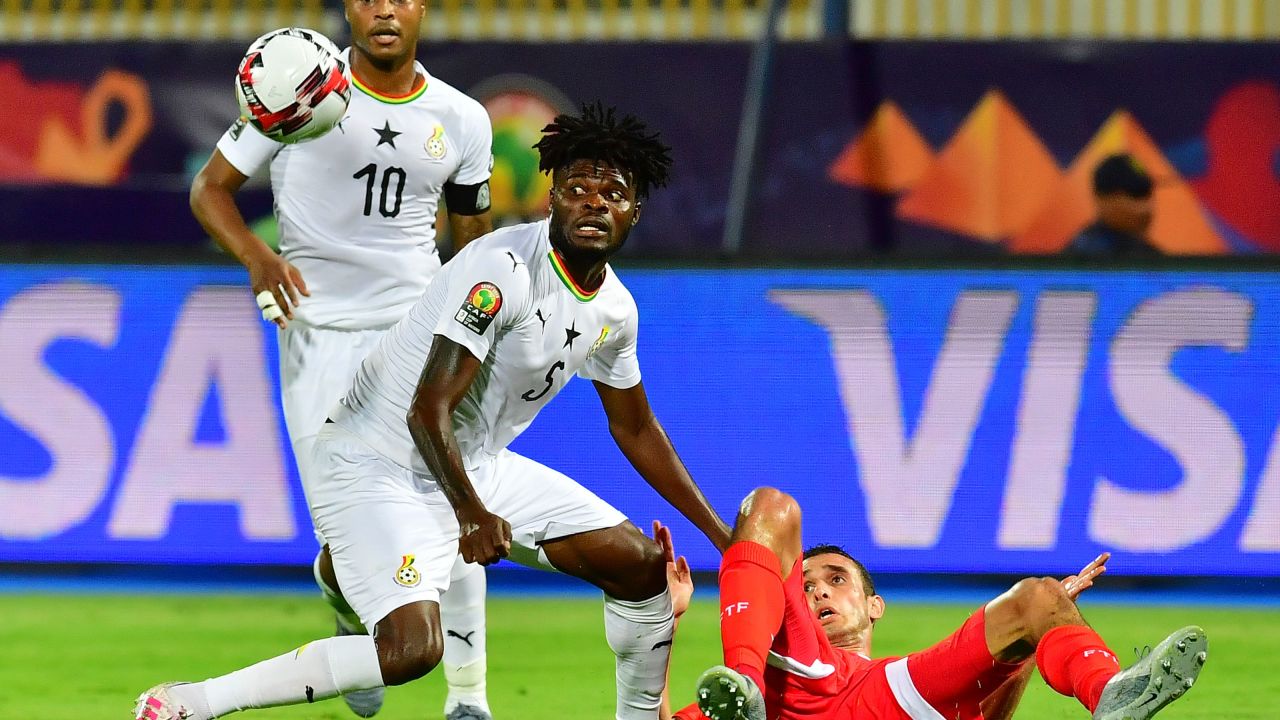 Partey (C) vies for the ball with Tunisia's forward Taha Yassine Khenissi (R) during the 2019 Africa Cup of Nations (CAN) Round of 16 football match between Ghana and Tunisia at the Ismailia Stadium in the Egyptian city on July 8, 2019.