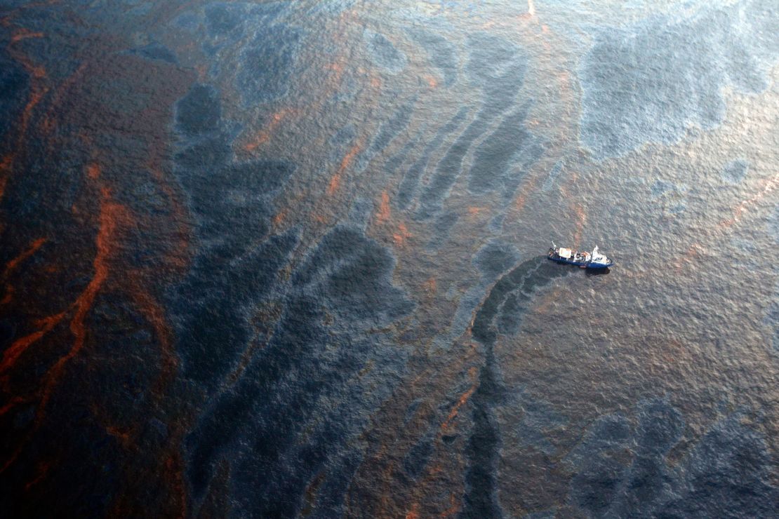 A boat works to collect oil that leaked from the Deepwater Horizon wellhead in the Gulf of Mexico near New Orleans on April 28, 2010, eight days after the explosion.