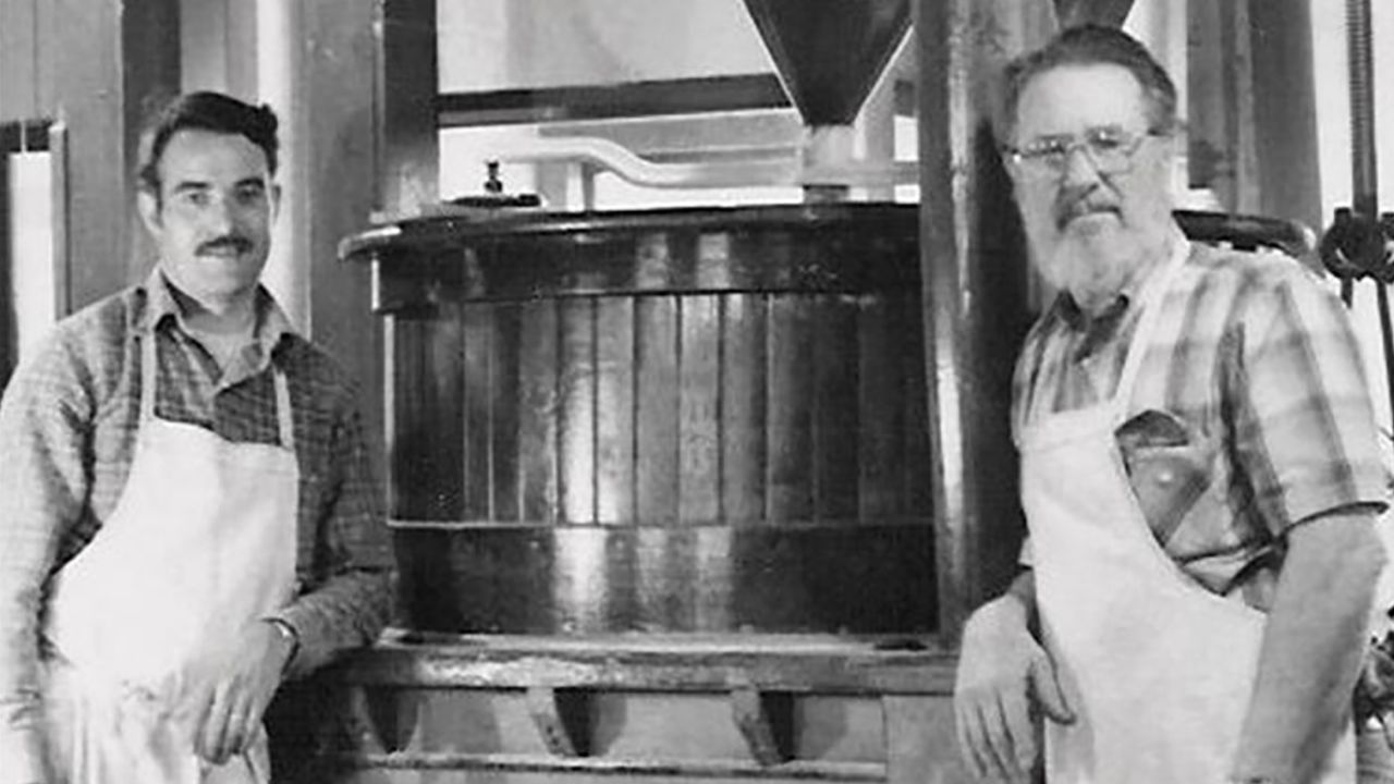 Moore, right, in front of a stone mill in 1979 with Craig Ratzat, one of the first employees at Bob's Red Mill.