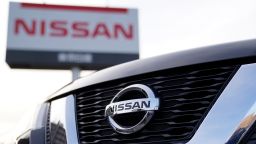The Nissan Motor Co. logo is seen on the grille of an X-Trail sports utility vehicle (SUV) displayed outside a Nissan dealership in Tokyo, Japan, on Sunday, Jan. 19, 2020. Nissan dealers say the Ghosn scandal has tarnished the companys image and hurt sales. A steady drip of Ghosn-related news, as well as the recent departure of one of the companys chief operating officers, have dominated headlines over the past month. Photographer: Toru Hanai/Bloomberg via Getty Images