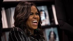 NEW YORK, NY - NOVEMBER 30: Former U.S. First Lady Michelle Obama laughs while signing copies of her new book 'Becoming' during a book signing event at a Barnes & Noble bookstore, November 30, 2018 in New York City. The former first lady's memoir has sold more than 2 million copies in all formats in North America during its first 15 days on the market, according to a statement released on Friday by Penguin Random House. (Photo by Drew Angerer/Getty Images)