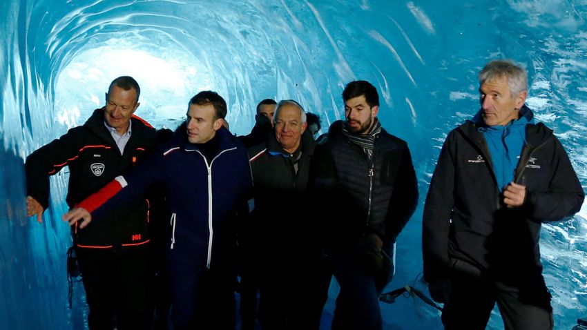 (From L) French president Emmanuel Macron with scientists visit the Mer de glace glacier near Chamonix, at the Mont Blanc mountain range in the French Alps on February 13, 2020. (Photo by Denis Balibouse/Pool/AFP/Getty Images)