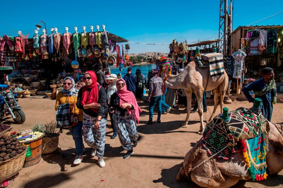 <strong>West Bank:</strong> The riverside floodplain is also spangled with giant statues like the Colossi of Memnon and a toppled statue of Ramses the Great that inspired Percy Bysshe Shelley's epic Ozymandias. This picture shows a bazaar in the Nubian village of Gharb Suhail, on the west bank of the Nile River.