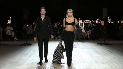 Free and unfettered! Gigi Hadid struts her model walk in tight