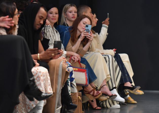 Lucy Liu (L) and Julianne Moore attend the Tory Burch fashion show during New York Fashion Week on February 9, 2020 in New York City. 