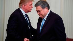 US President Donald Trump (L) shakes hands with US Attorney General William Barr (R) during the Public Safety Officer Medal of Valor presentation ceremony at the White House in Washington, DC on May 22, 2019. (Photo by Jim WATSON / AFP)        (Photo credit should read JIM WATSON/AFP via Getty Images)