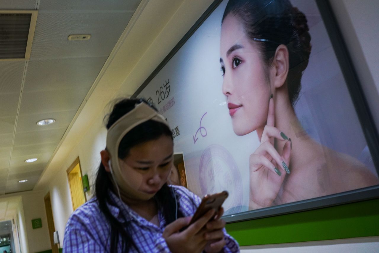 A woman pictured inside Huamei Medical Cosmetology Hospital in Shanghai.