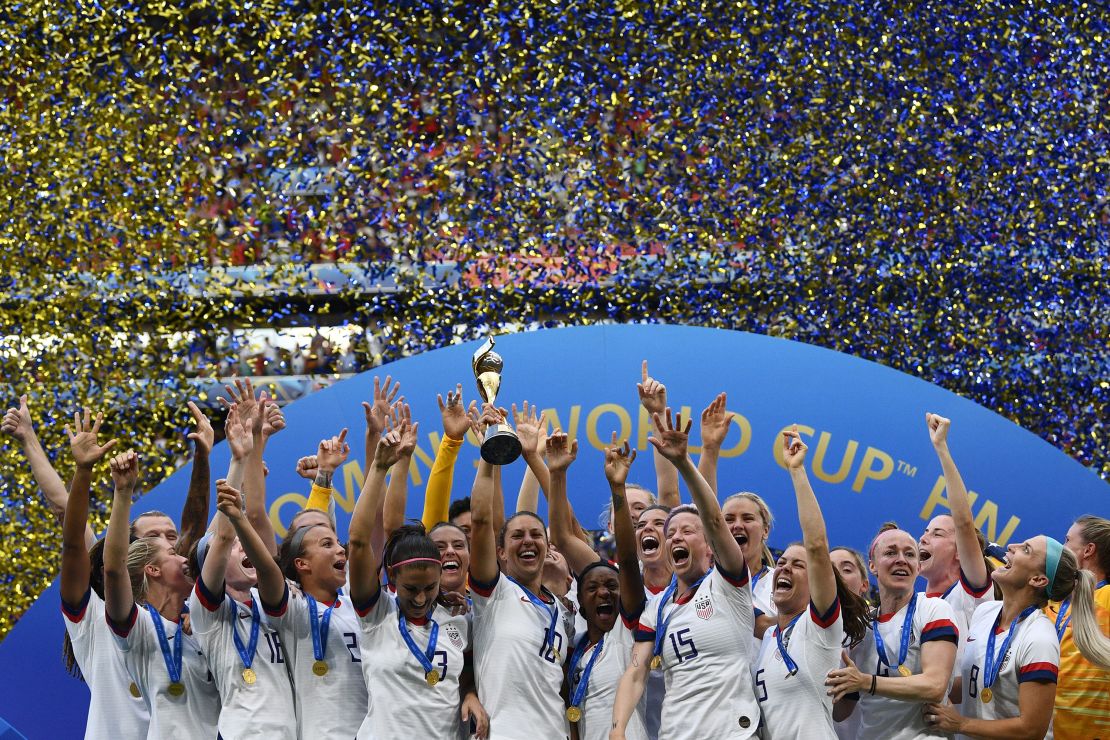 The USWNT celebrates with the trophy after the France 2019 Womens World Cup football final match against the Netherlands.