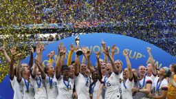 TOPSHOT - USA's players celebrate with the trophy after the France 2019 Womens World Cup football final match between USA and the Netherlands, on July 7, 2019, at the Lyon Stadium in Lyon, central-eastern France. (Photo credit should read FRANCK FIFE/AFP via Getty Images)