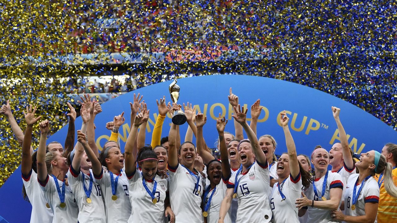 The USWNT celebrates with the trophy after the France 2019 Womens World Cup football final match against the Netherlands.