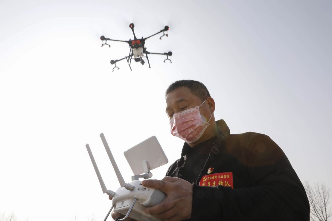 A local resident using a drone spraying disinfectant at a village in China's central Henan province in January.