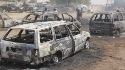 In this photograph taken in Auno on February 10, 2020, cars burnt down by suspected members of the Islamic State West Africa Province (ISWAP) during an attack on February 9, 2020, is seen. - Jihadists killed at least 30 people and abducted women and children in a raid in northeast Nigeria's restive Borno state, a regional government spokesman said on February 10, 2020.The attack on February 9, 2020 targeted the village of Auno where jihadists stormed in on trucks mounted with heavy weapons, killing, burning and looting before kidnapping women and children. (Photo by AUDU MARTE / AFP) (Photo by AUDU MARTE/AFP via Getty Images)